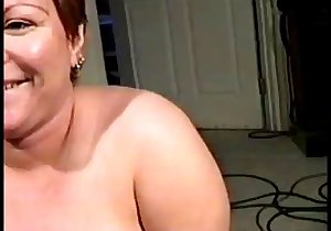 Redheaded lady eagerly sucking a fat boner here