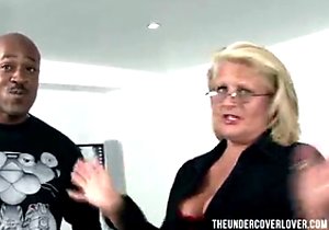 Moaning granny rides a black man's hard cock