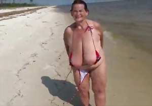 Take a look at these gigantic melons of a hot brunette