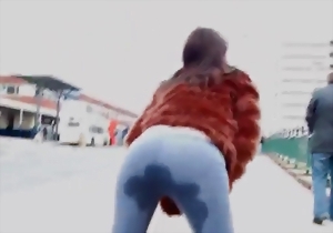 Cute brunette in tight jeans shows her awesome curves